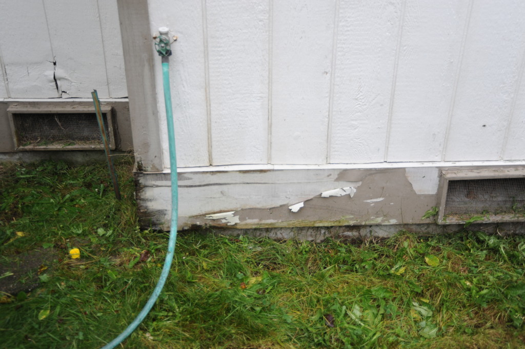 We discovered a running water sound coming from this faucet.  We suspect that perhaps there is a leak either within the wall, or in the crawl space.  The surrounding siding and boards are soft and wet.  Probably need to replace that portion of siding