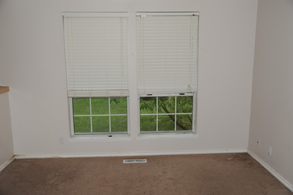 Downstairs living room, blinds are broken, replace with inexpensive mini-blinds.