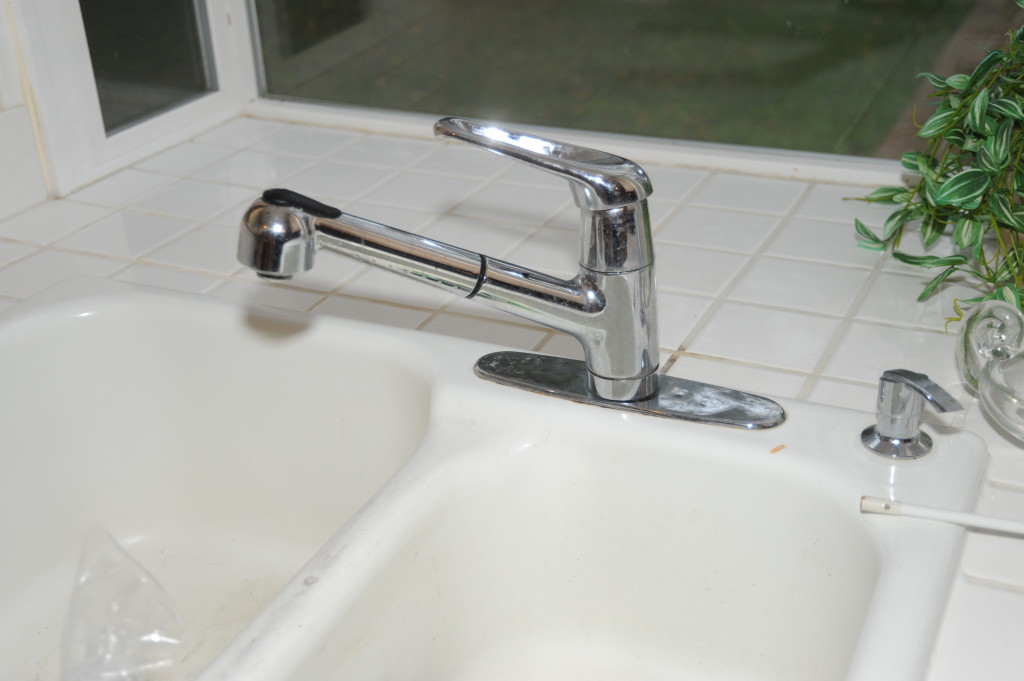 Kitchen faucet, extremely loose, replace with a nicer nickel finish faucet.  