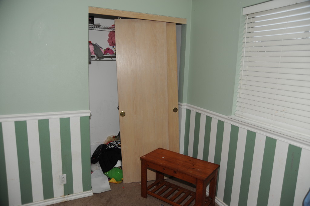 2nd bedroom closet.  Clean.  Fix or replace doors.  